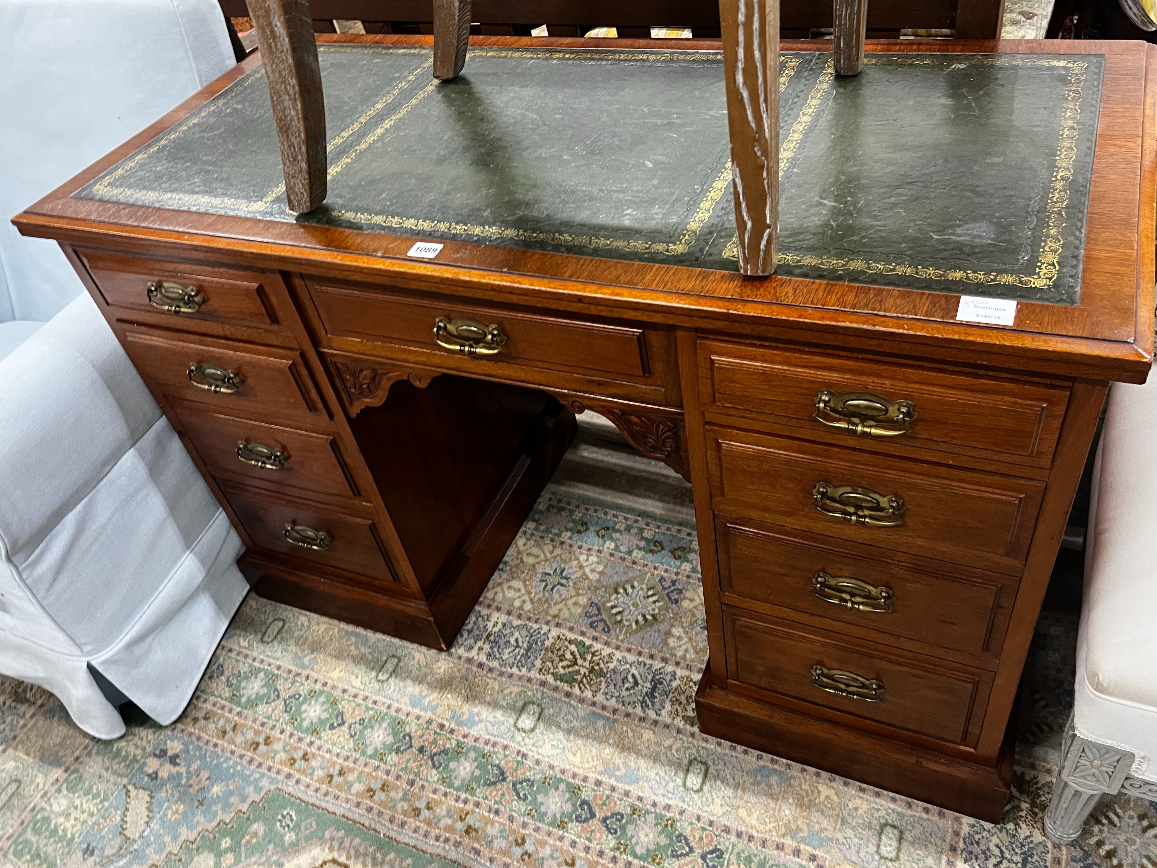 A late Victorian mahogany kneehole writing desk, width 122cm, depth 55cm, height 75cm together with an Oka limed oak chair
